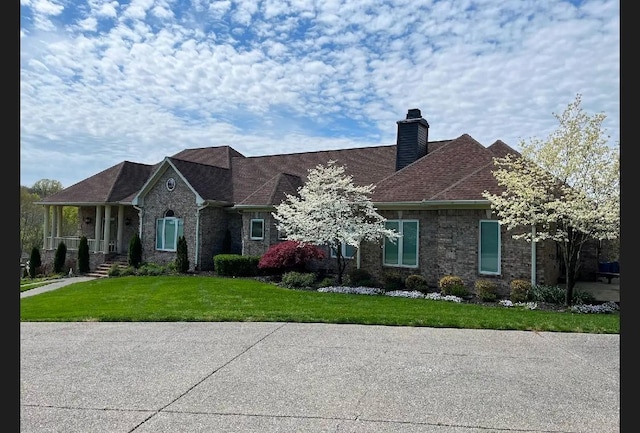1825 Lake Meadow Trl, Mount Juliet, TN 37122 - view of front of home featuring a chimney, a front lawn, and brick siding