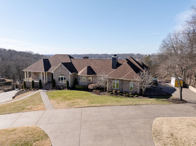 1825 Lake Meadow Trl, Mount Juliet, TN 37122 - view of front of property featuring a chimney, a front yard, brick siding, and a shingled roof