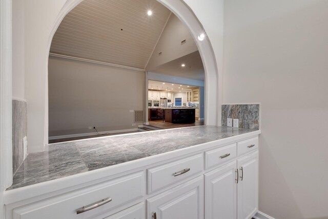 1825 Lake Meadow Trl, Mount Juliet, TN 37122 - kitchen with tile counters, backsplash, arched walkways, white cabinets, and high vaulted ceiling
