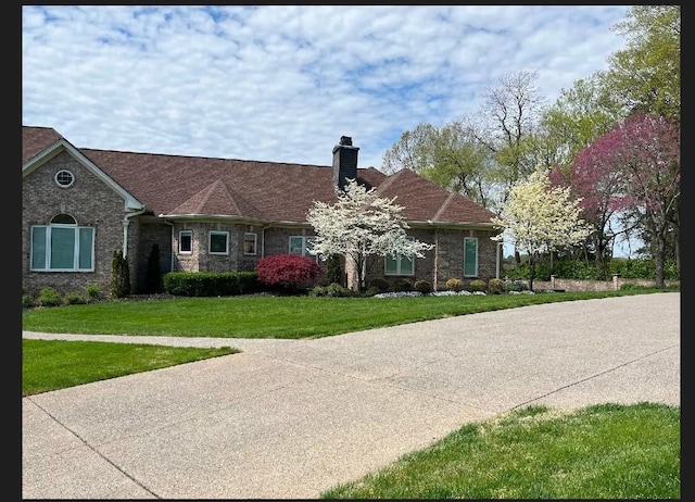 1825 Lake Meadow Trl, Mount Juliet, TN 37122 - view of front of property with a chimney, a front lawn, and brick siding