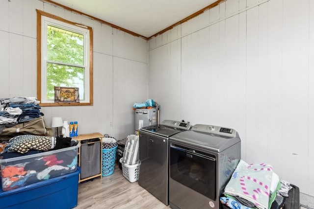 330 Union Camp Rd, Lafayette, TN 37083 - washroom featuring washing machine and clothes dryer, light wood finished floors, and ornamental molding