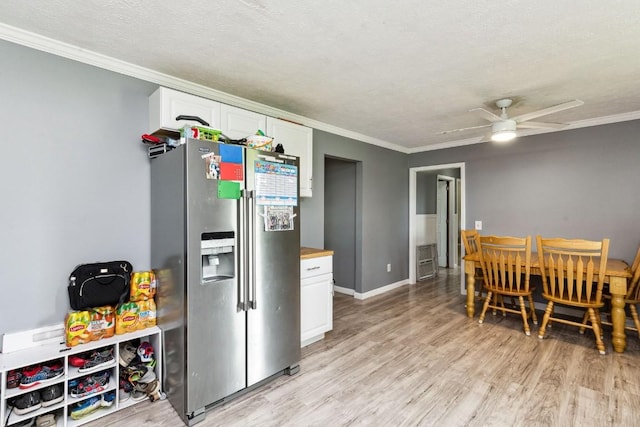 330 Union Camp Rd, Lafayette, TN 37083 - dining space featuring light wood-type flooring, crown molding, ceiling fan, and a textured ceiling