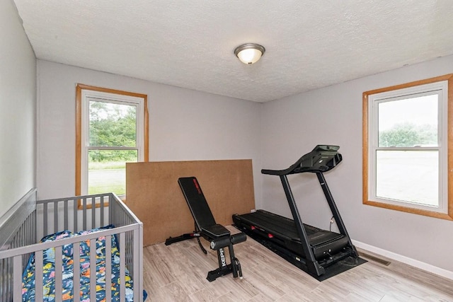 330 Union Camp Rd, Lafayette, TN 37083 - workout area featuring wood finished floors and a textured ceiling