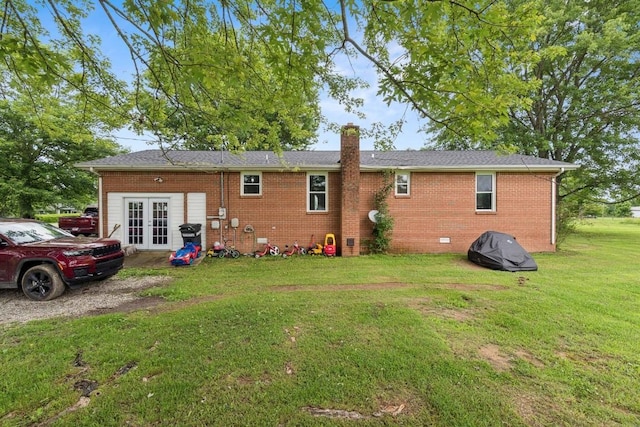 330 Union Camp Rd, Lafayette, TN 37083 - rear view of house with french doors, a chimney, brick siding, and a lawn