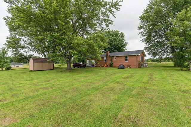330 Union Camp Rd, Lafayette, TN 37083 - view of green lawn featuring a storage shed