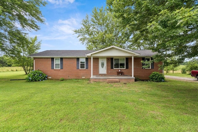 330 Union Camp Rd, Lafayette, TN 37083 - single story home with a front lawn, brick siding, covered porch, and crawl space