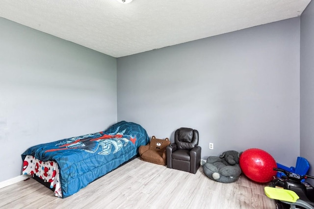 330 Union Camp Rd, Lafayette, TN 37083 - bedroom with wood finished floors and a textured ceiling