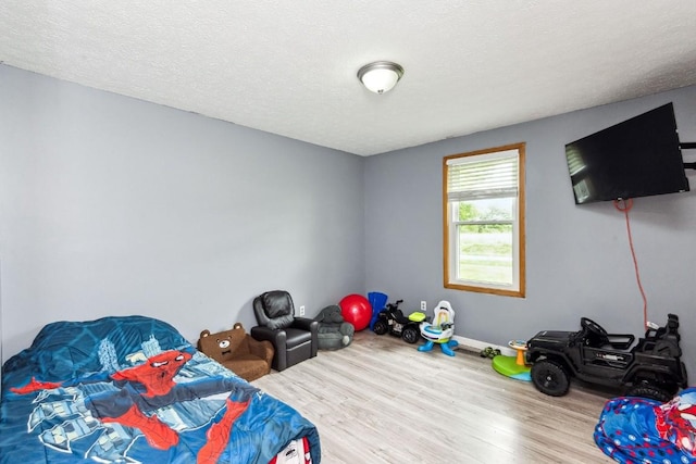 330 Union Camp Rd, Lafayette, TN 37083 - bedroom featuring wood finished floors and a textured ceiling