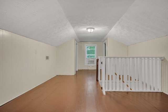 3328 Church St, Burns, TN 37029 - additional living space with a textured ceiling, hardwood / wood-style floors, cooling unit, and vaulted ceiling