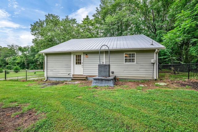 3328 Church St, Burns, TN 37029 - rear view of house with entry steps and a metal roof