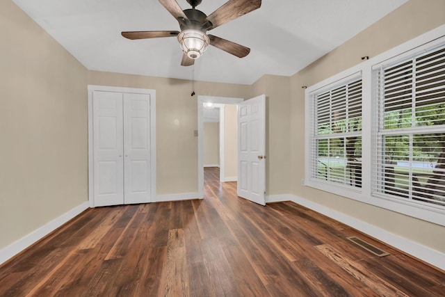 3328 Church St, Burns, TN 37029 - unfurnished bedroom featuring dark wood finished floors and ceiling fan