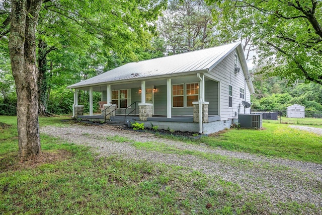 3328 Church St, Burns, TN 37029 - view of front facade featuring a porch and a metal roof