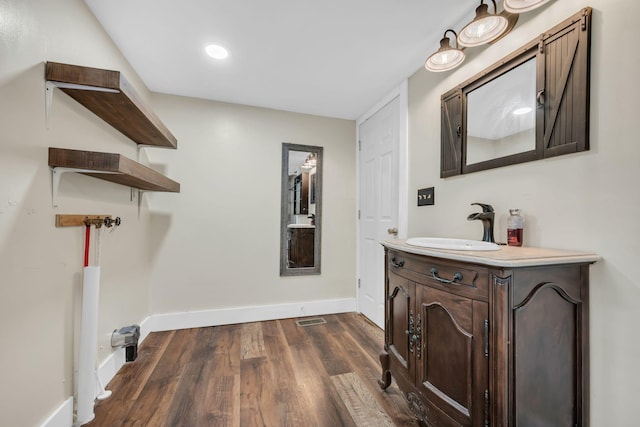 3328 Church St, Burns, TN 37029 - bathroom featuring wood finished floors, vanity, and recessed lighting
