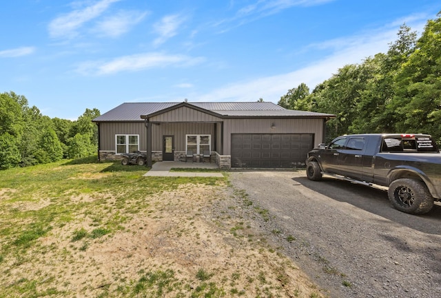 196 Deer Haven Rd, Indian Mound, TN 37079 - view of front facade with an attached garage, dirt driveway, a metal roof, stone siding, and board and batten siding