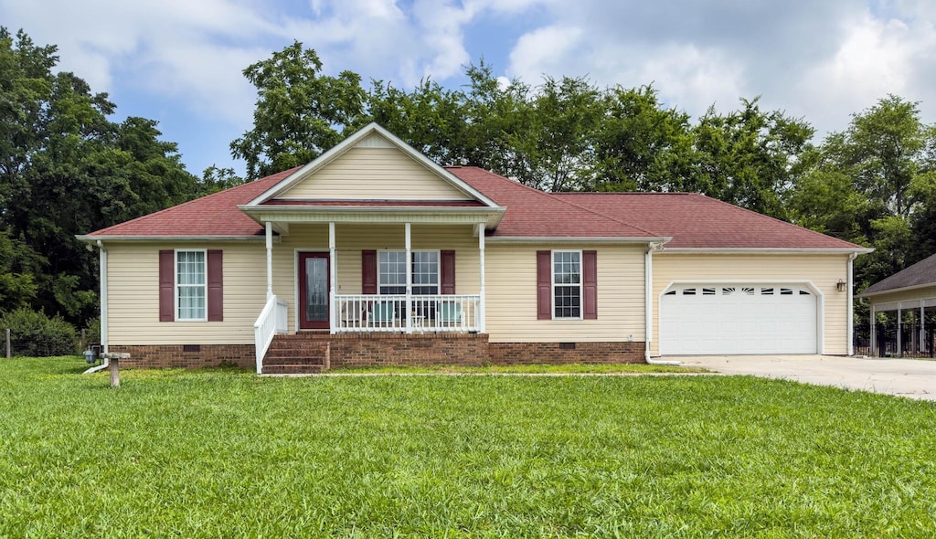 202 Chesapeake Dr, Tullahoma, TN 37388 - view of front of house with crawl space, a porch, an attached garage, and concrete driveway