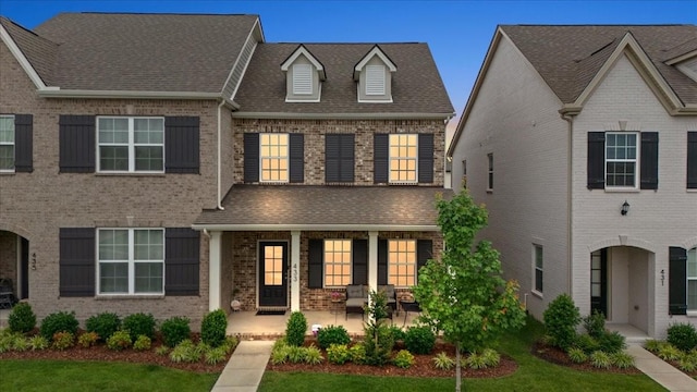 433 Longstone Rd, Gallatin, TN 37066 - view of front of house with a porch, brick siding, and roof with shingles
