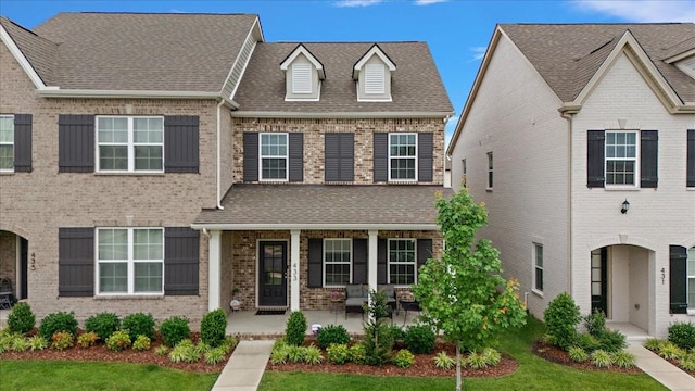 433 Longstone Rd, Gallatin, TN 37066 - view of front of house with covered porch, brick siding, and a shingled roof