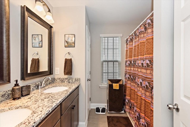 433 Longstone Rd, Gallatin, TN 37066 - full bathroom featuring double vanity and baseboards