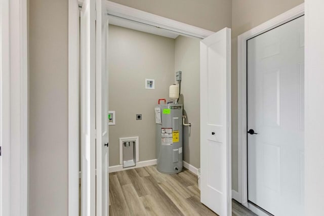 115 Carl Williams Rd, Crofton, KY 42217 - laundry area featuring hookup for an electric dryer, electric water heater, washer hookup, and light wood-type flooring