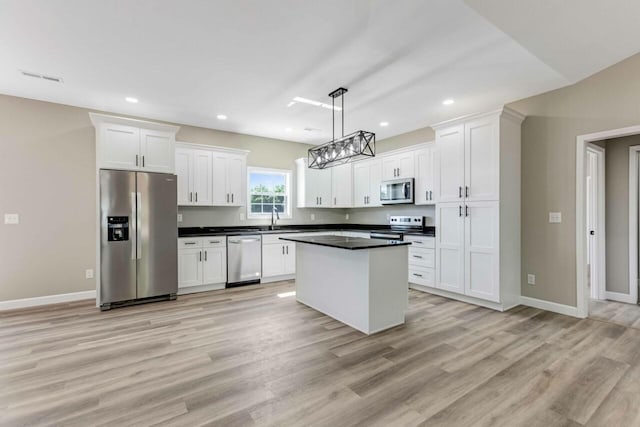 115 Carl Williams Rd, Crofton, KY 42217 - kitchen featuring appliances with stainless steel finishes, white cabinetry, light wood-style flooring, decorative light fixtures, and recessed lighting
