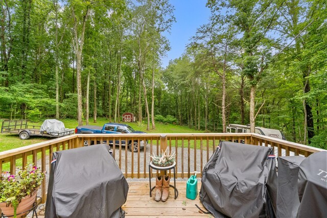 516 Cedarcrest Dr, Chapmansboro, TN 37035 - deck with area for grilling and a shed