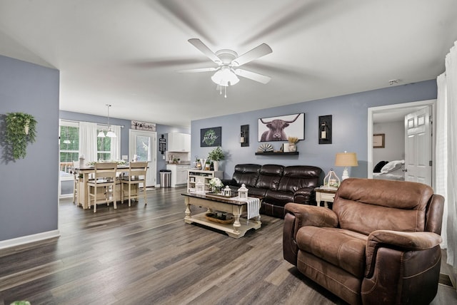 516 Cedarcrest Dr, Chapmansboro, TN 37035 - living area with ceiling fan and dark wood-style floors