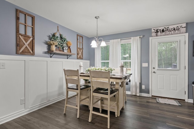 516 Cedarcrest Dr, Chapmansboro, TN 37035 - dining room with a chandelier, dark wood finished floors, and wainscoting