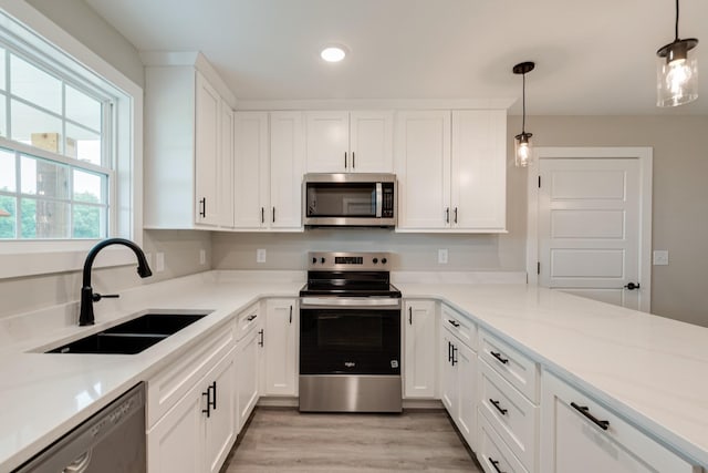 916 Butler Bridge Rd, Portland, TN 37148 - kitchen with stainless steel appliances, white cabinets, recessed lighting, light countertops, and light wood-style flooring