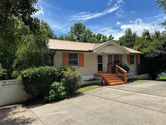 4946 Packard Dr, Nashville, TN 37211 - ranch-style home featuring brick siding and a metal roof