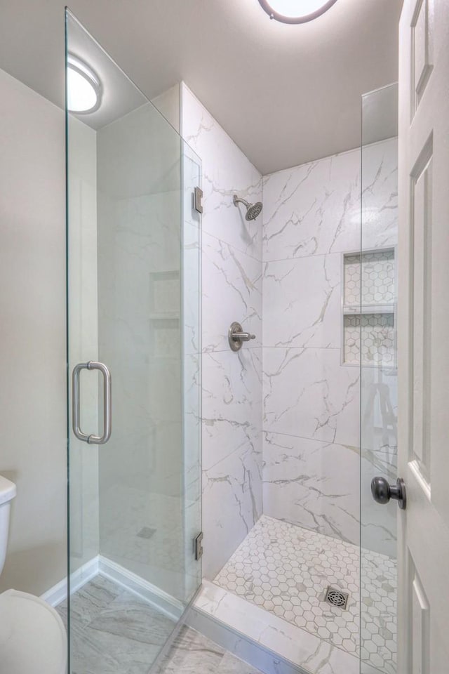 265 Stanley Park Ln, Franklin, TN 37069 - full bathroom featuring a marble finish shower and marble look tiles