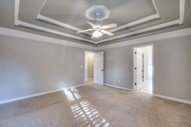 265 Stanley Park Ln, Franklin, TN 37069 - carpeted spare room with a tray ceiling, ornamental molding, and a ceiling fan