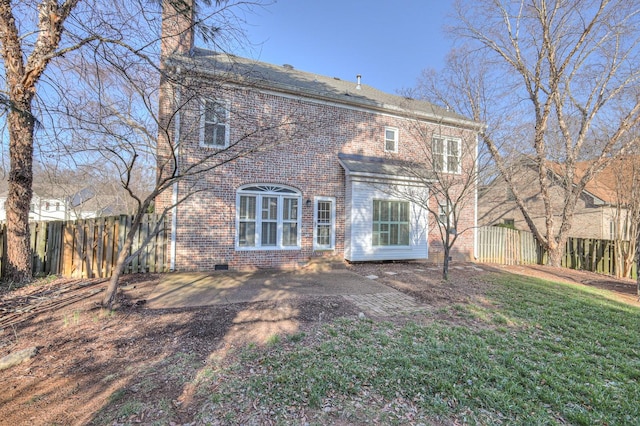 265 Stanley Park Ln, Franklin, TN 37069 - rear view of house featuring brick siding, a chimney, and crawl space