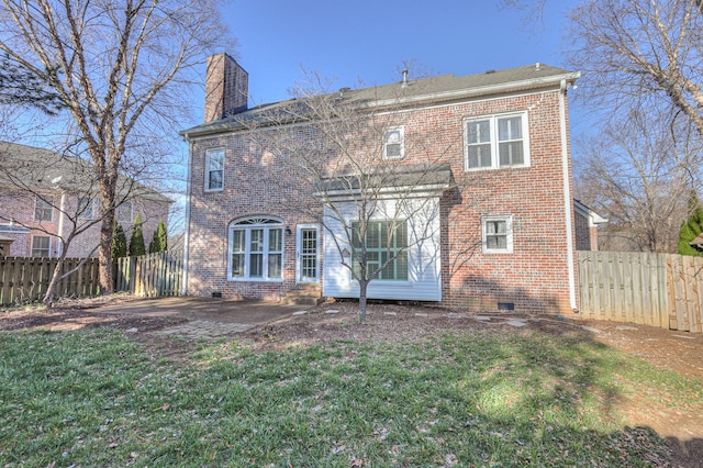 265 Stanley Park Ln, Franklin, TN 37069 - rear view of property featuring brick siding, a chimney, a fenced backyard, and crawl space
