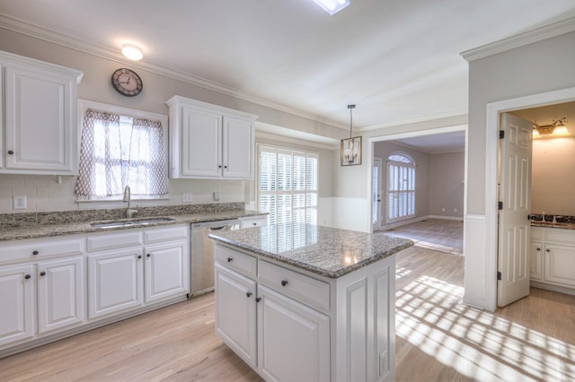 265 Stanley Park Ln, Franklin, TN 37069 - kitchen with dishwasher, light wood-style floors, white cabinets, and ornamental molding