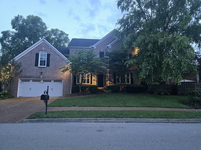 265 Stanley Park Ln, Franklin, TN 37069 - traditional-style house featuring brick siding, driveway, and a garage