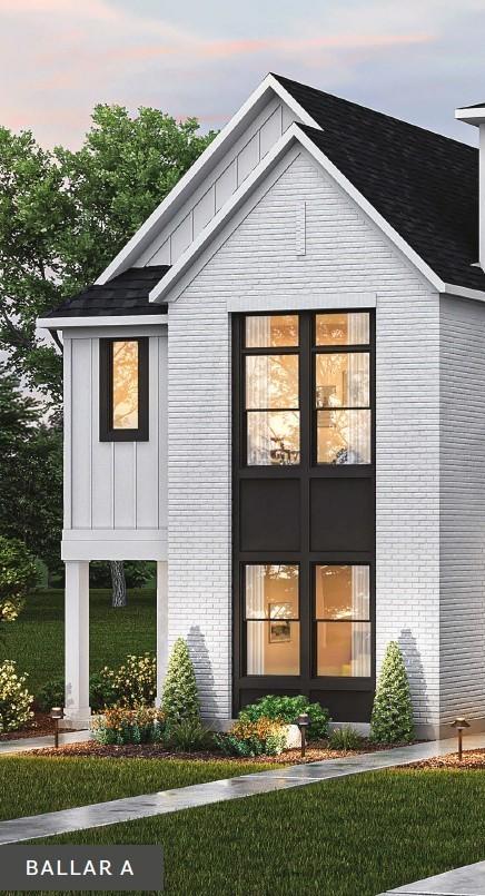 2092 Conductor Ln, Thompsons Station, TN 37179 - view of front of property with brick siding, a yard, and a shingled roof