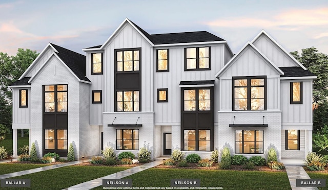 2092 Conductor Ln, Thompsons Station, TN 37179 - view of front facade featuring board and batten siding, a front lawn, and brick siding