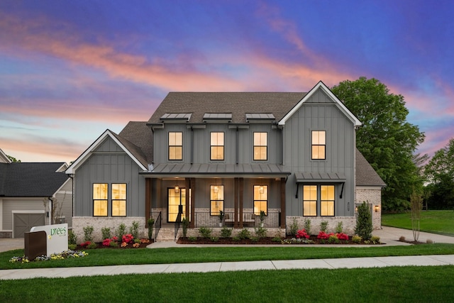 3005 Littlebury Park Dr, Thompsons Station, TN 37179 - modern inspired farmhouse with board and batten siding, a porch, a standing seam roof, a front yard, and driveway