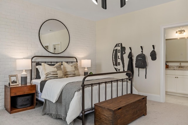 3005 Littlebury Park Dr, Thompsons Station, TN 37179 - carpeted bedroom featuring connected bathroom, a ceiling fan, and brick wall