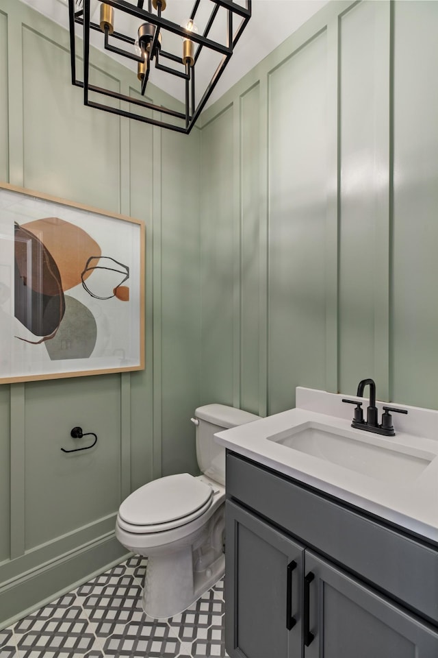 3005 Littlebury Park Dr, Thompsons Station, TN 37179 - bathroom with a decorative wall, vanity, a chandelier, and tile patterned floors