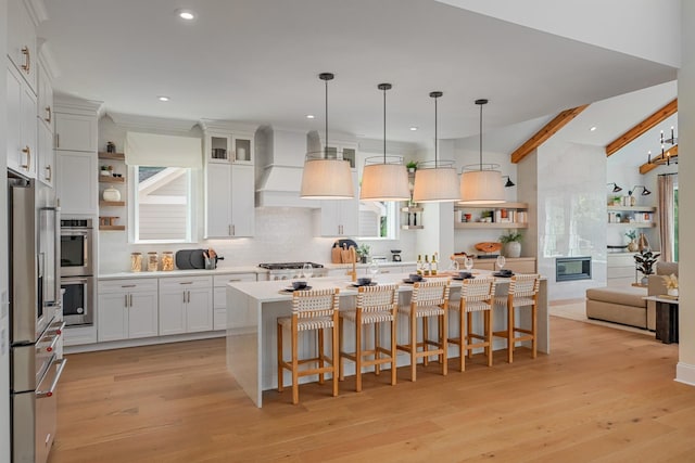 3005 Littlebury Park Dr, Thompsons Station, TN 37179 - kitchen featuring open shelves, decorative backsplash, light countertops, light wood-type flooring, and recessed lighting