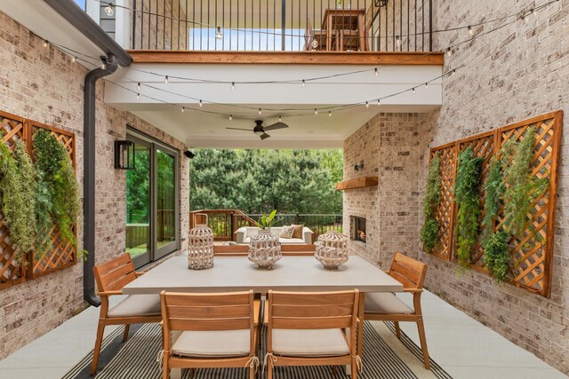 3005 Littlebury Park Dr, Thompsons Station, TN 37179 - patio / terrace featuring an outdoor brick fireplace, outdoor dining area, a patio, and a ceiling fan