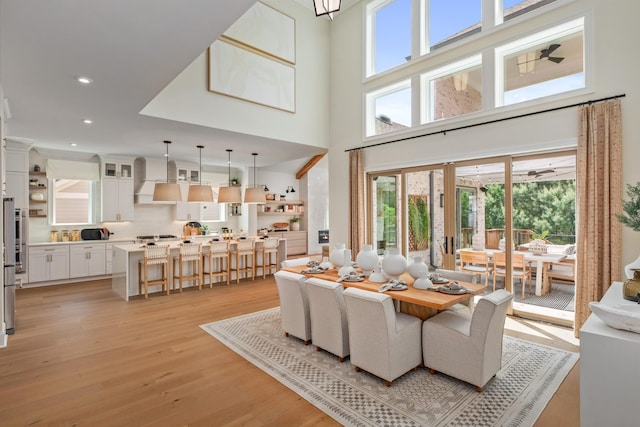 3005 Littlebury Park Dr, Thompsons Station, TN 37179 - living area featuring light wood finished floors, a towering ceiling, and recessed lighting