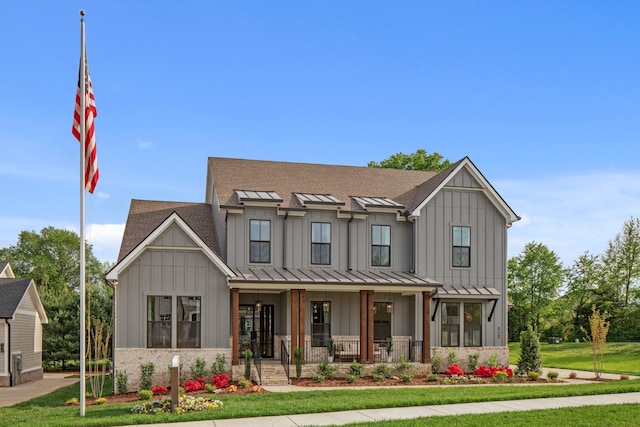 3005 Littlebury Park Dr, Thompsons Station, TN 37179 - modern farmhouse featuring covered porch, board and batten siding, a standing seam roof, and a front yard