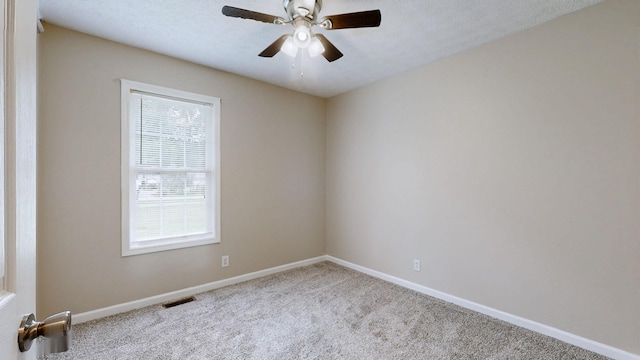 1726 Old Clarksville Pike, Chapmansboro, TN 37035 - carpeted empty room featuring baseboards and a ceiling fan