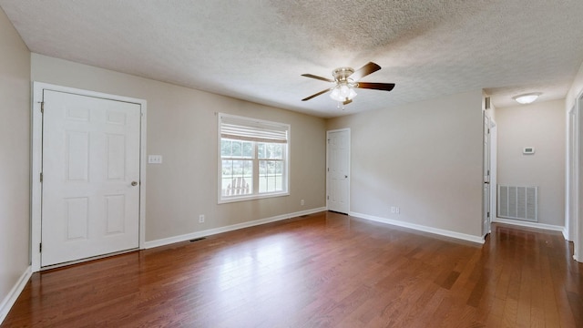 1726 Old Clarksville Pike, Chapmansboro, TN 37035 - unfurnished room featuring wood finished floors, ceiling fan, and a textured ceiling