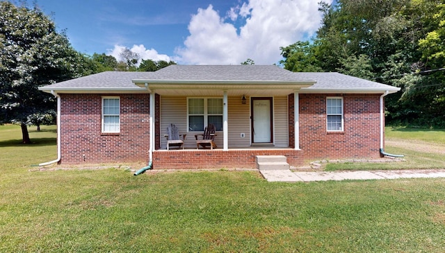 1726 Old Clarksville Pike, Chapmansboro, TN 37035 - view of front of home featuring a porch, a shingled roof, a front yard, and brick siding