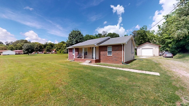 1726 Old Clarksville Pike, Chapmansboro, TN 37035 - view of front of property with covered porch, an outbuilding, a garage, driveway, and brick siding