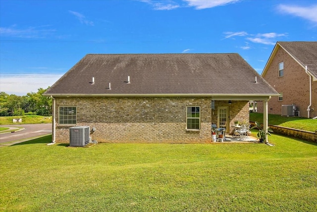 3028 Honeysuckle Dr, Spring Hill, TN 37174 - rear view of house featuring a patio area, brick siding, a yard, and roof with shingles