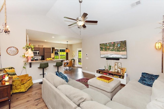 3028 Honeysuckle Dr, Spring Hill, TN 37174 - living area featuring light wood-type flooring, ceiling fan, a chandelier, and high vaulted ceiling